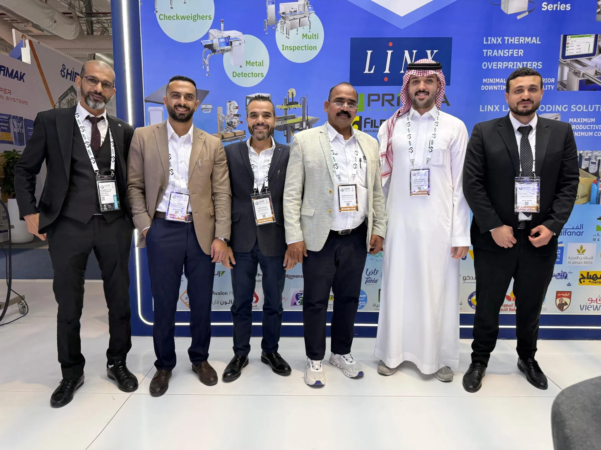 Six people from the ITEC team in front of the printed stand backdrop, Saudi Food Manufacturing 2025